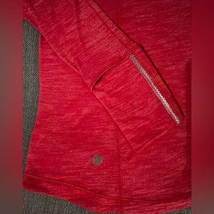 Red lululemon long sleeve with thumb holes.